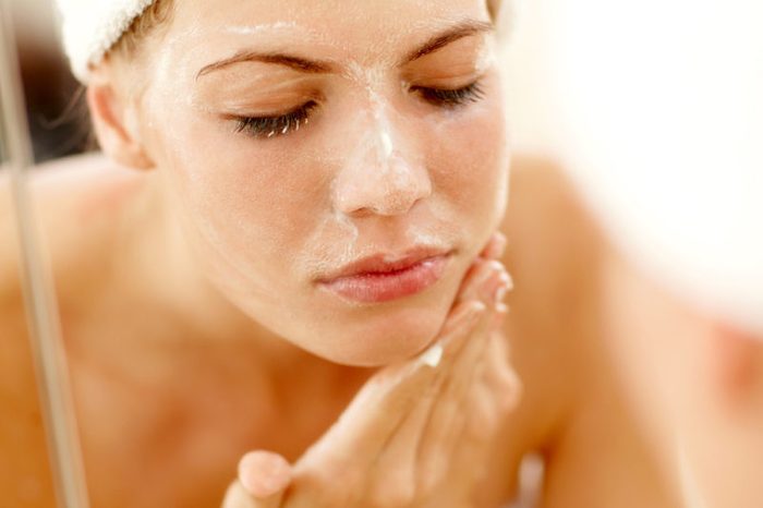 woman washing face
