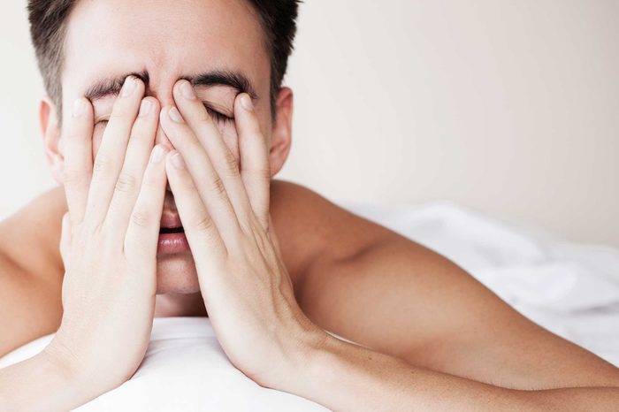 Tired man unable to sleep