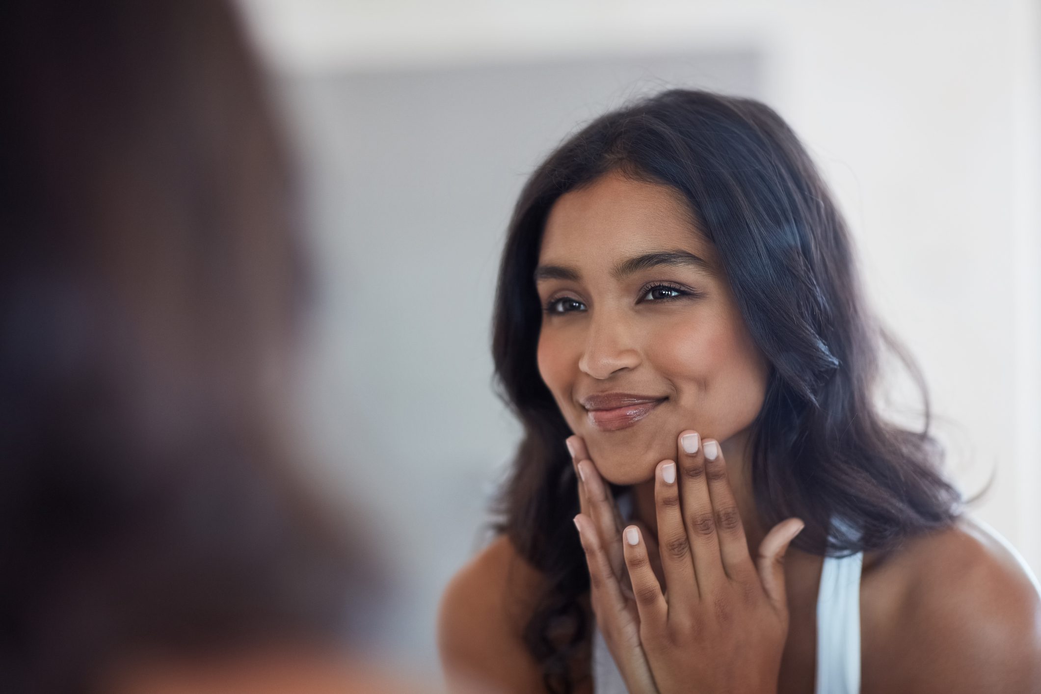 woman smiling in mirror