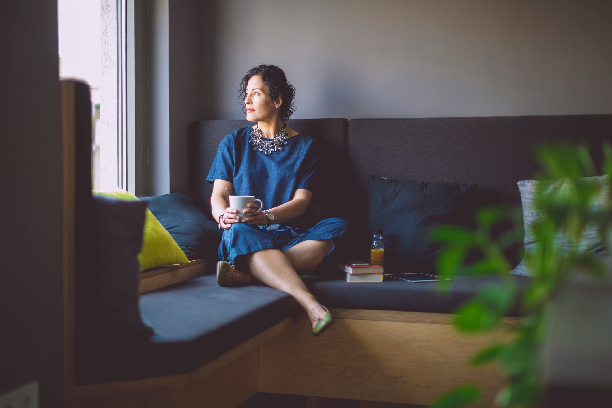 woman reflecting looking out of window