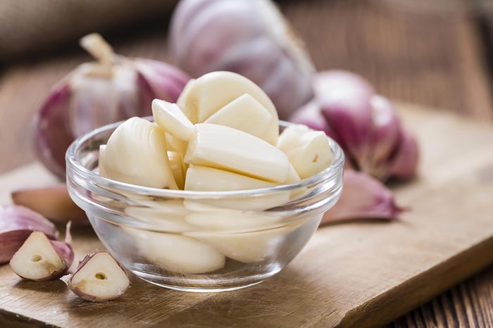 Bowl of pealed garlic cloves. 