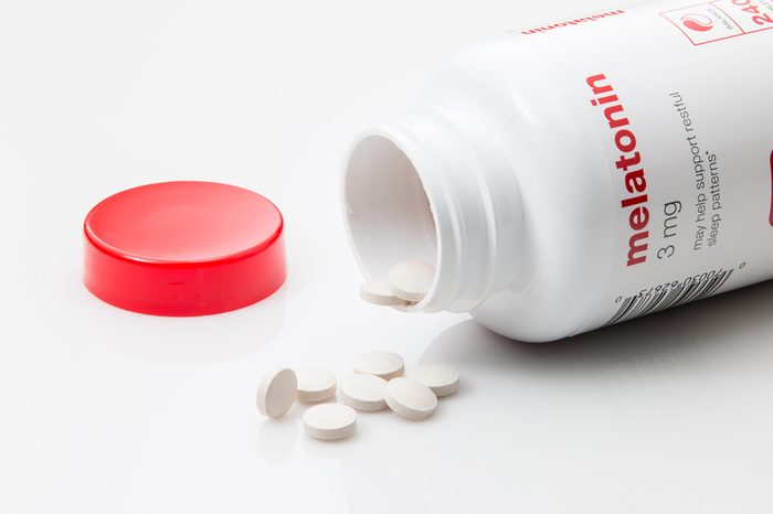 melatonin bottle with pills