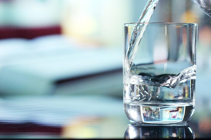 Pouring water into a glass