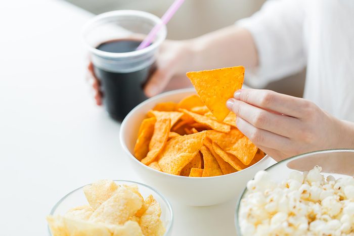 person snacking on junk food