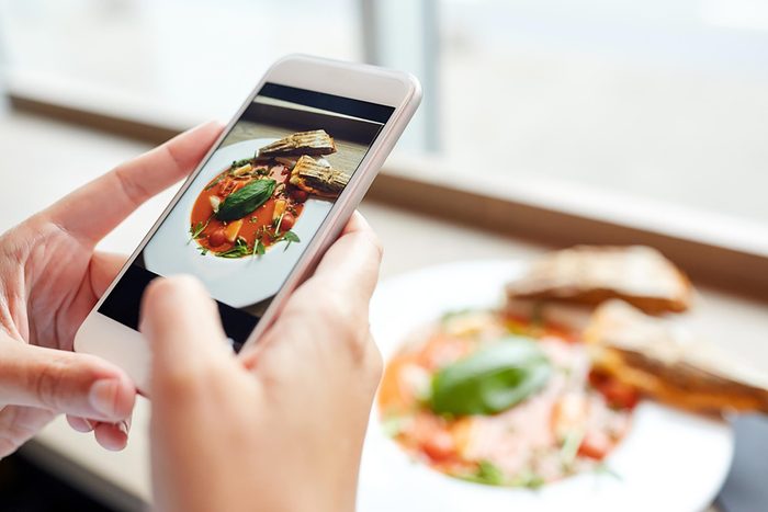 person looking at food on phone
