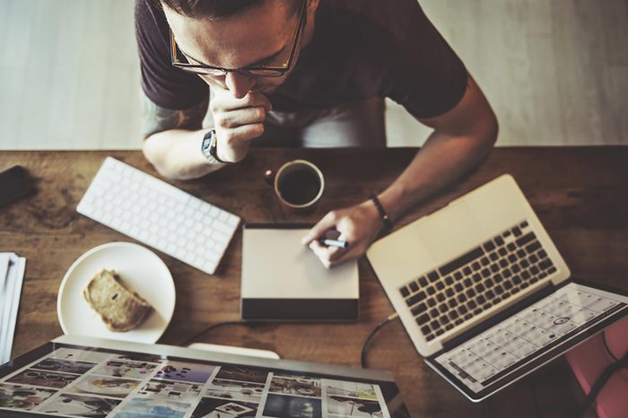 man working at his office computer