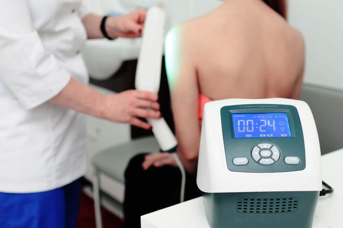 Woman receiving phototherapy treatment.