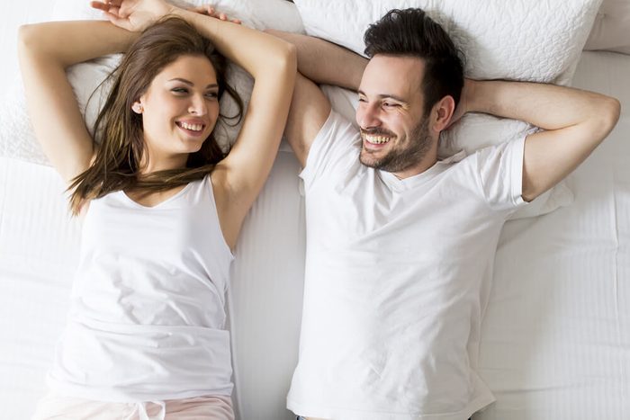 Young loving couple in the bed