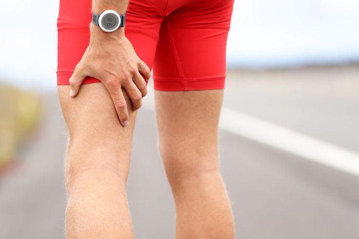 man holding hamstring injury