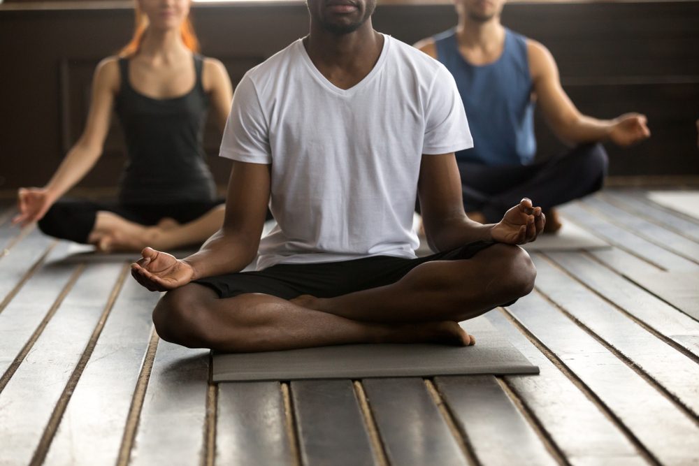 group of people practicing yoga