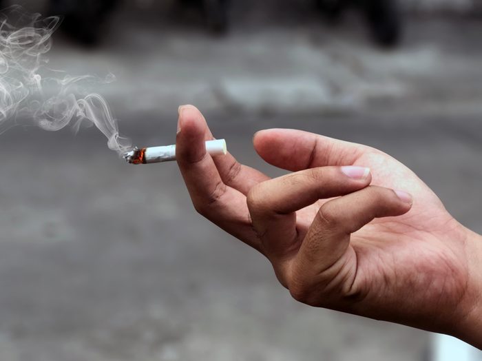 hand holding a cigarette