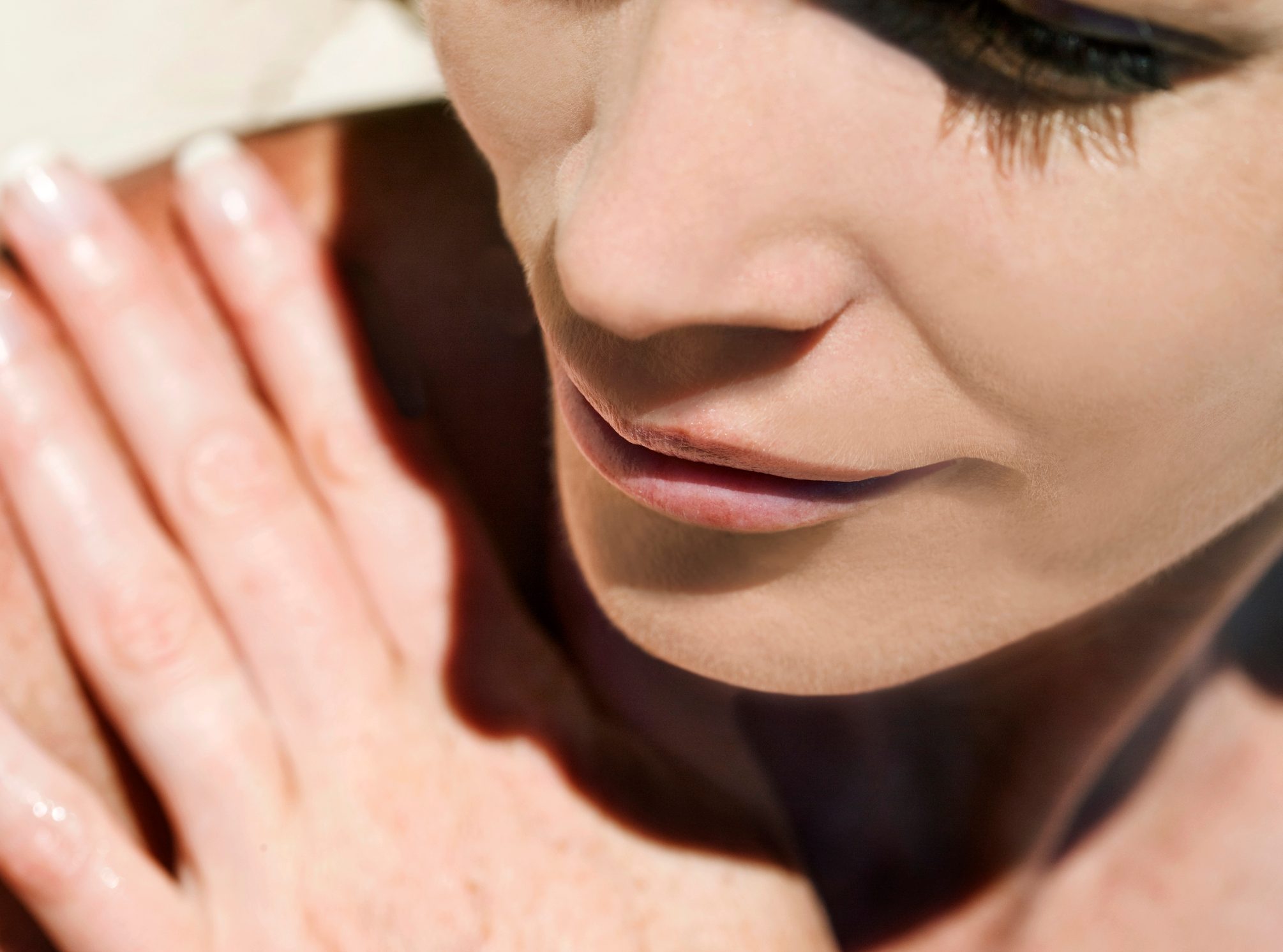 close up of young woman in the sunshine